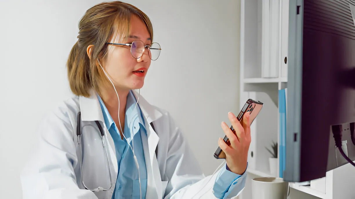 Doctor providing virtual urgent care through phone consultation.